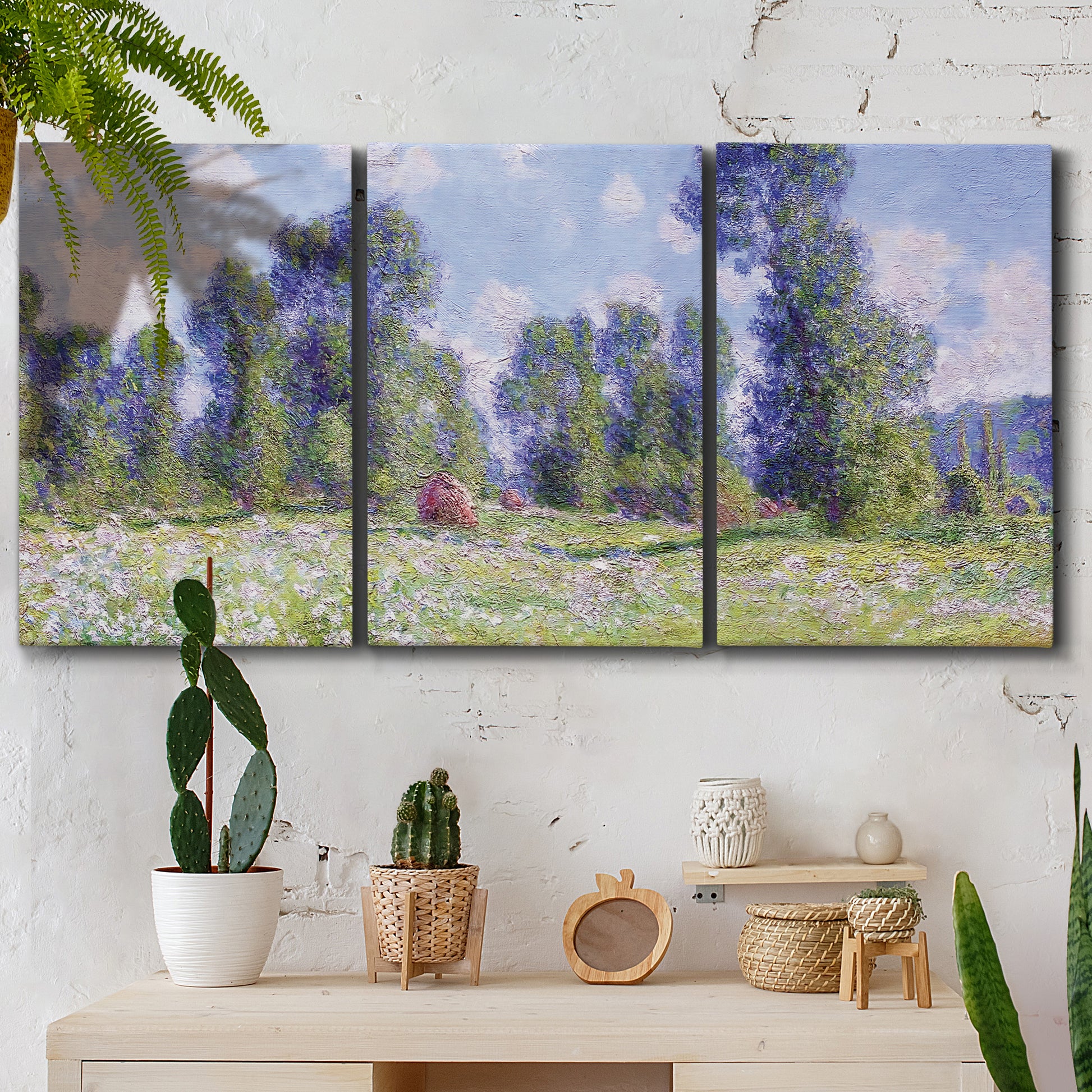 Three-panel canvas wall art featuring poppy field near garden village, displayed in a boho-chic entryway above a console table.