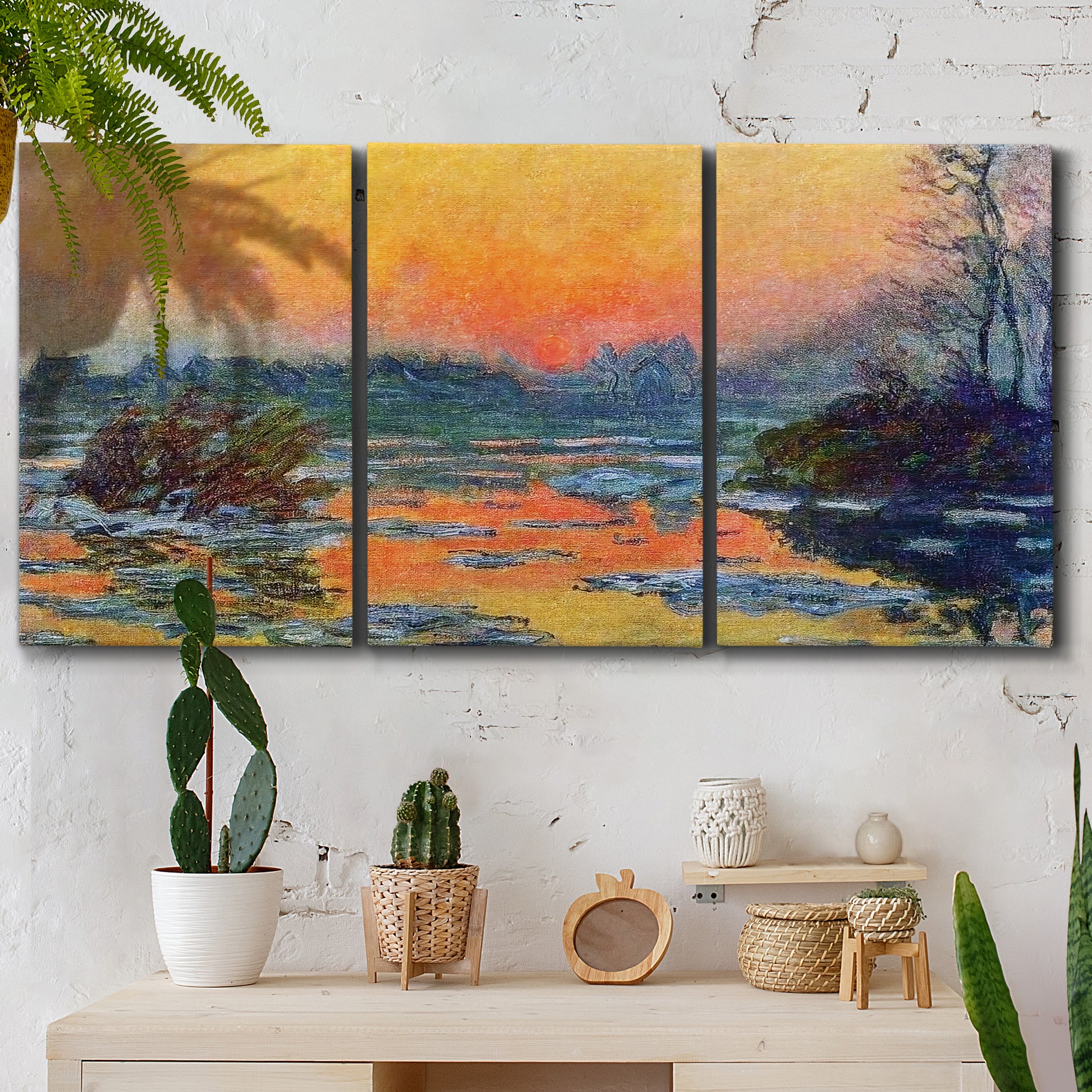 Three-panel canvas wall art featuring winter sunset over river, displayed in a boho-chic entryway above a console table.