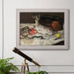 Impressionist still life painting of fish by Édouard Manet in an ornate weathered white frame displayed in a light-toned interior setting.