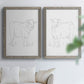 Set of two gray barnwood framed canvas prints depicting fine gray lines, white backgrounds, and quiet farm-animal profiles arranged across two complementary compositions above a sofa in a bright living space.