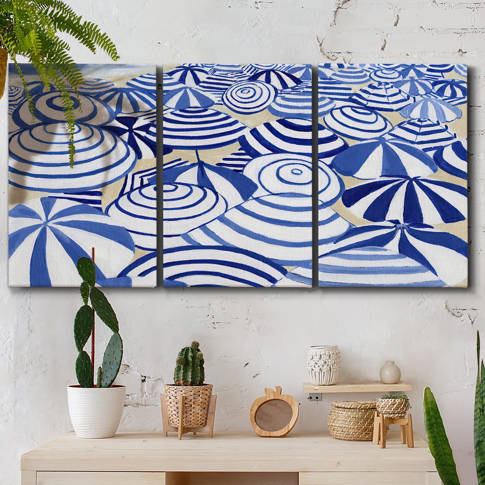 Three-panel canvas wall art featuring geometric abstract bowl forms, displayed in a boho-chic entryway above a console table.
