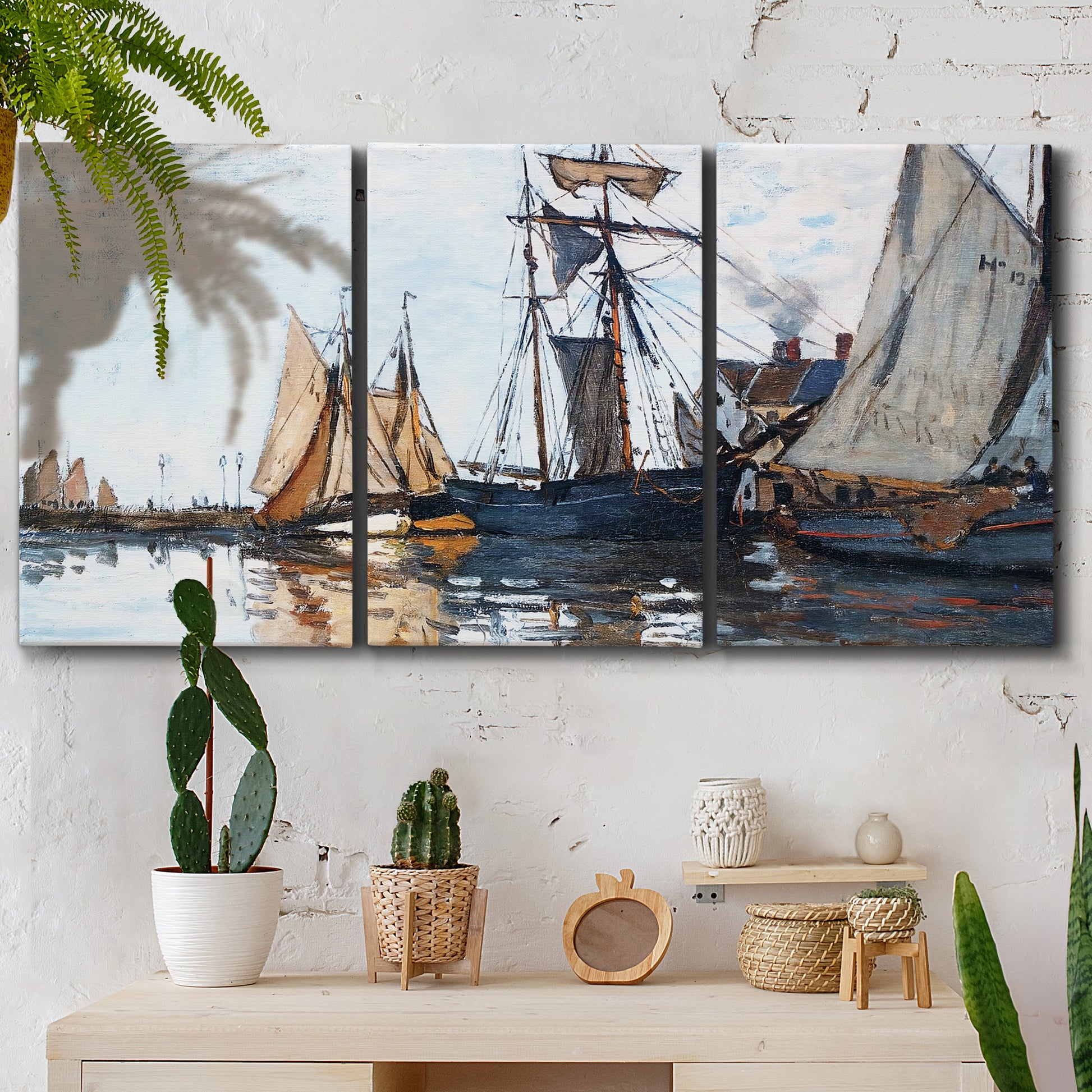 Three-panel canvas wall art featuring fishing boats navigating open water, displayed in a boho-chic entryway above a console table.