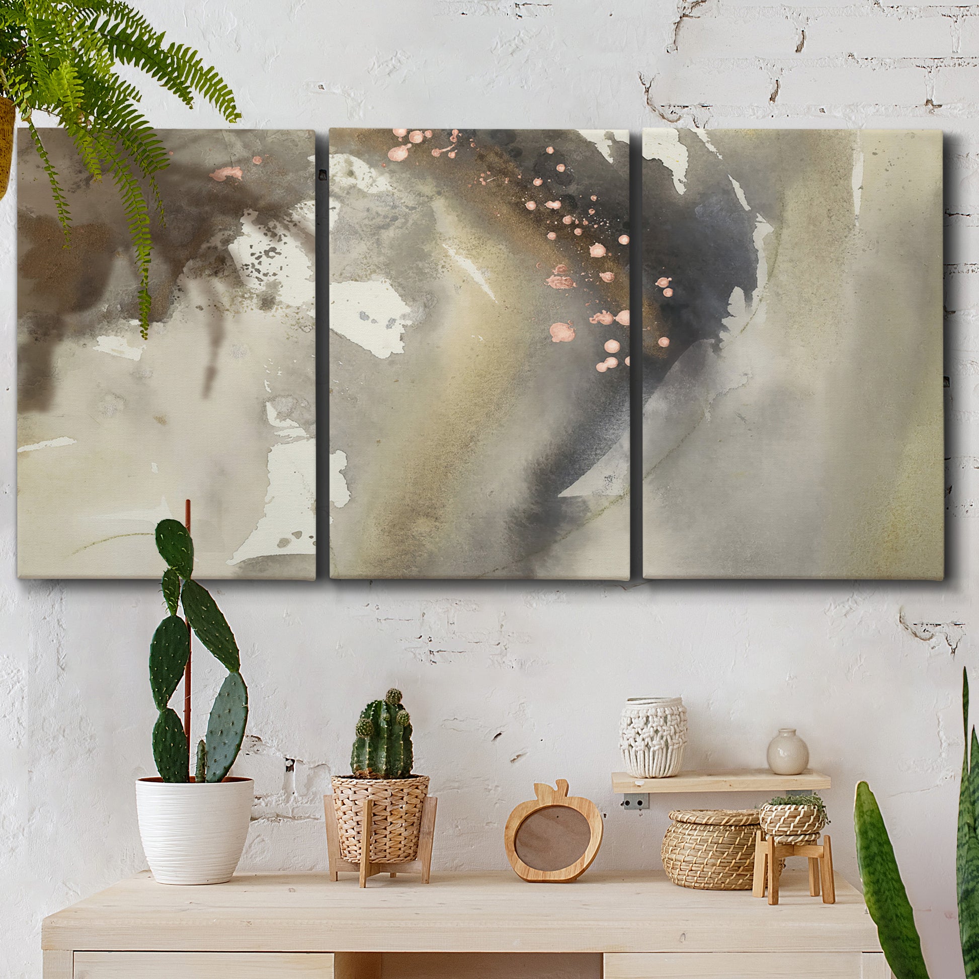 Three-panel canvas wall art featuring flowing abstract wave motion, displayed in a boho-chic entryway above a console table.