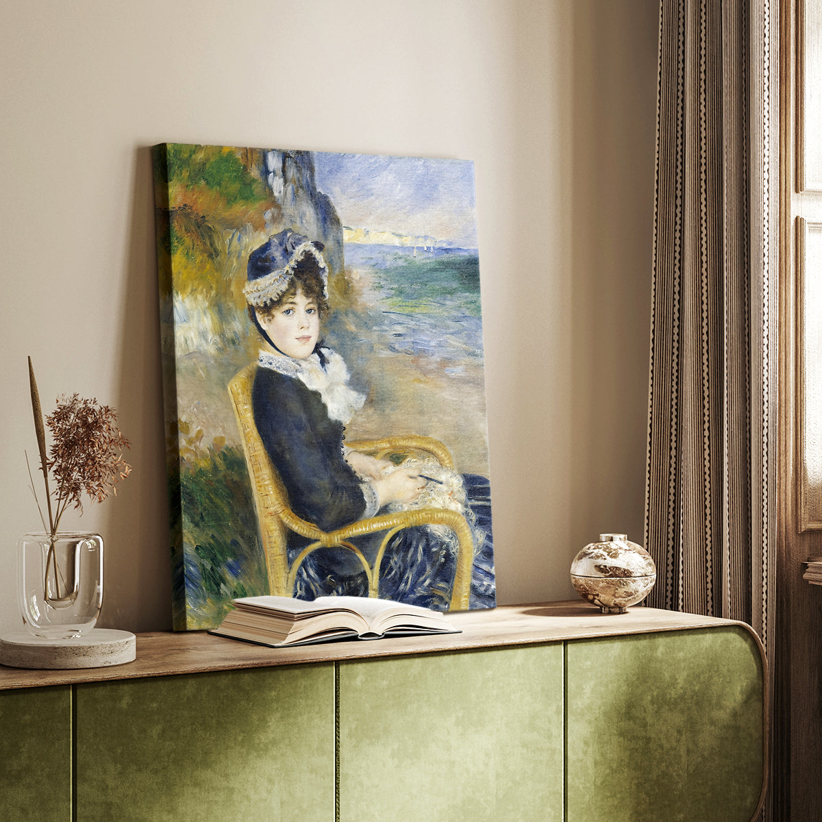 Canvas art print of a coastal scene with a seated figure and flowing garments styled in a home decor setting.