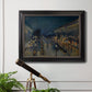 Impressionist nighttime Paris street scene by Camille Pissarro in an ornate black frame with gilded inner detail displayed in a light-toned interior setting.