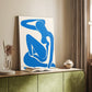 Canvas art print of a stylized body formed from flat geometric pieces styled in a home decor setting.