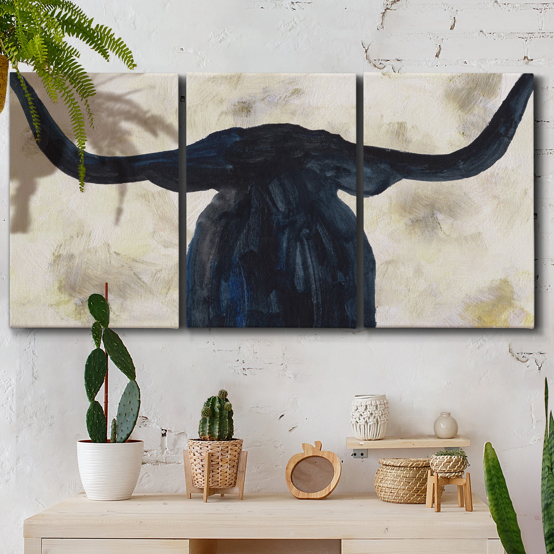 Three-panel canvas wall art featuring rustic animal portrait illustration, displayed in a boho-chic entryway above a console table.