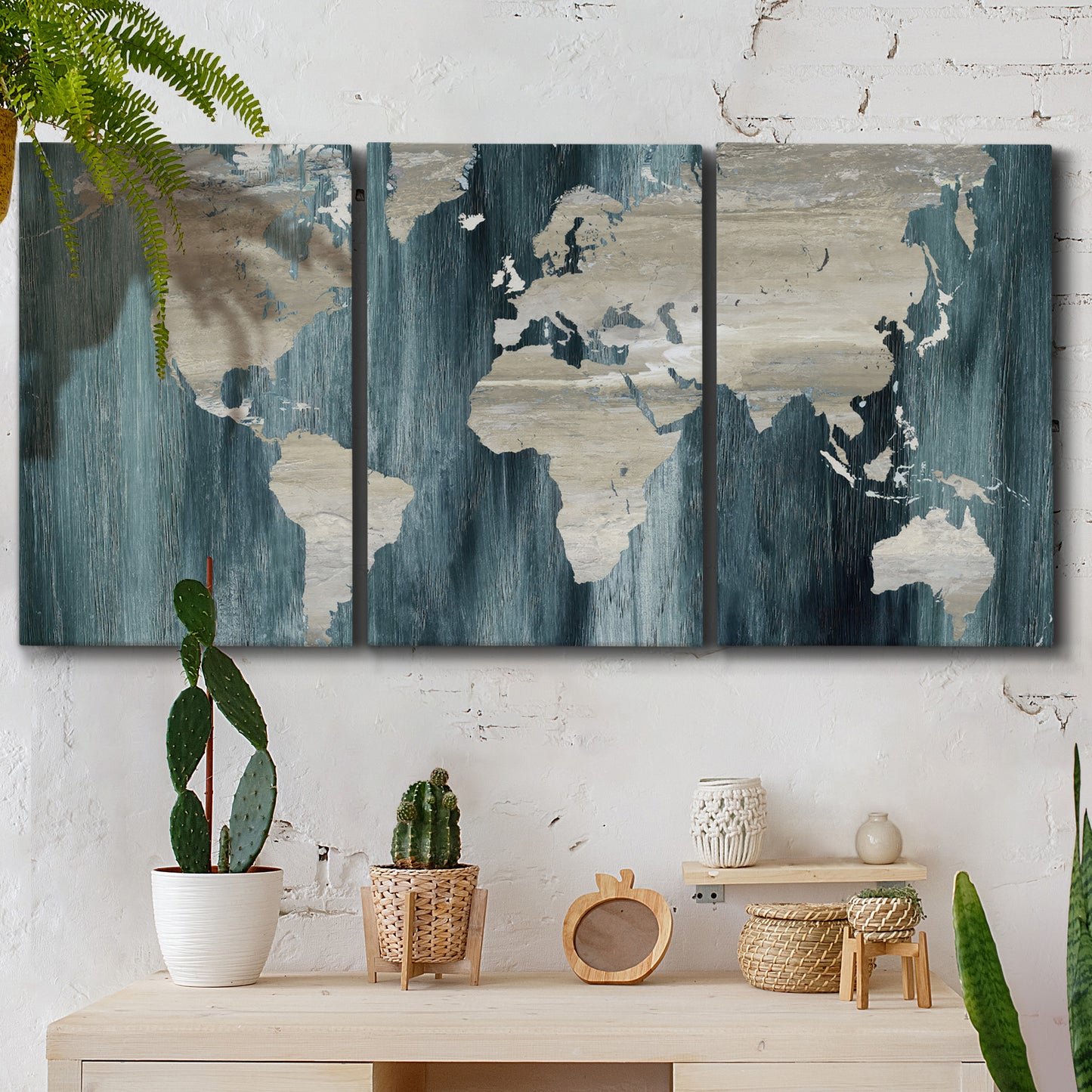 Three-panel canvas wall art featuring golden coastal sunset with cliffs, displayed in a boho-chic entryway above a console table.