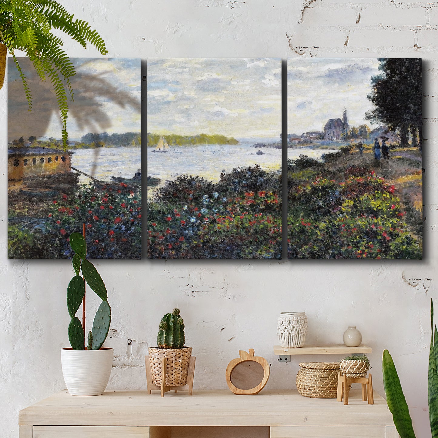 Three-panel canvas wall art featuring river with boats and shoreline, displayed in a boho-chic entryway above a console table.