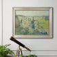 Impressionist rural hay harvest landscape by Camille Pissarro in an ornate champagne frame displayed in a light-toned interior setting.