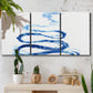 Three-panel canvas wall art featuring indigo abstract vapor watercolor, displayed in a boho-chic entryway above a console table.