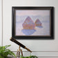 Impressionist winter haystack scene with sunlight by Claude Monet in an ornate black frame with gilded inner detail displayed in a light-toned interior setting.
