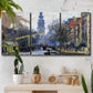 Three-panel canvas wall art featuring historic tower beside canal, displayed in a boho-chic entryway above a console table.