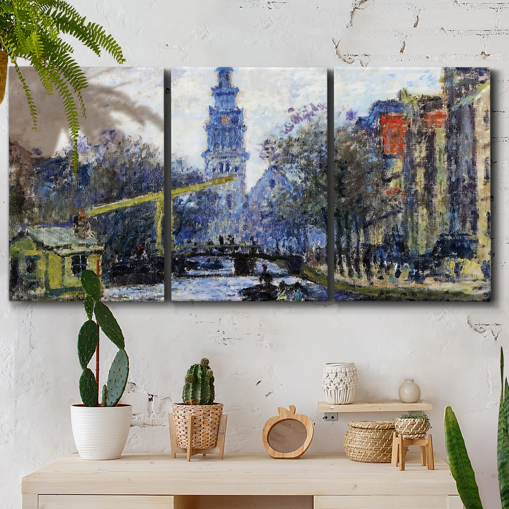 Three-panel canvas wall art featuring historic tower beside canal, displayed in a boho-chic entryway above a console table.