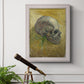 Profile skull study artwork by Vincent van Gogh in an ornate weathered white frame displayed in a light-toned interior setting.