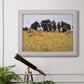 Impressionist rural harvest scene by John Singer Sargent in an ornate weathered white frame displayed in a light-toned interior setting.