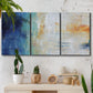 Three-panel canvas wall art featuring deep blue abstract grotto tones, displayed in a boho-chic entryway above a console table.