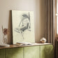 Canvas art print of a relaxed seated figure with minimal shading and light detail styled in a home decor setting.