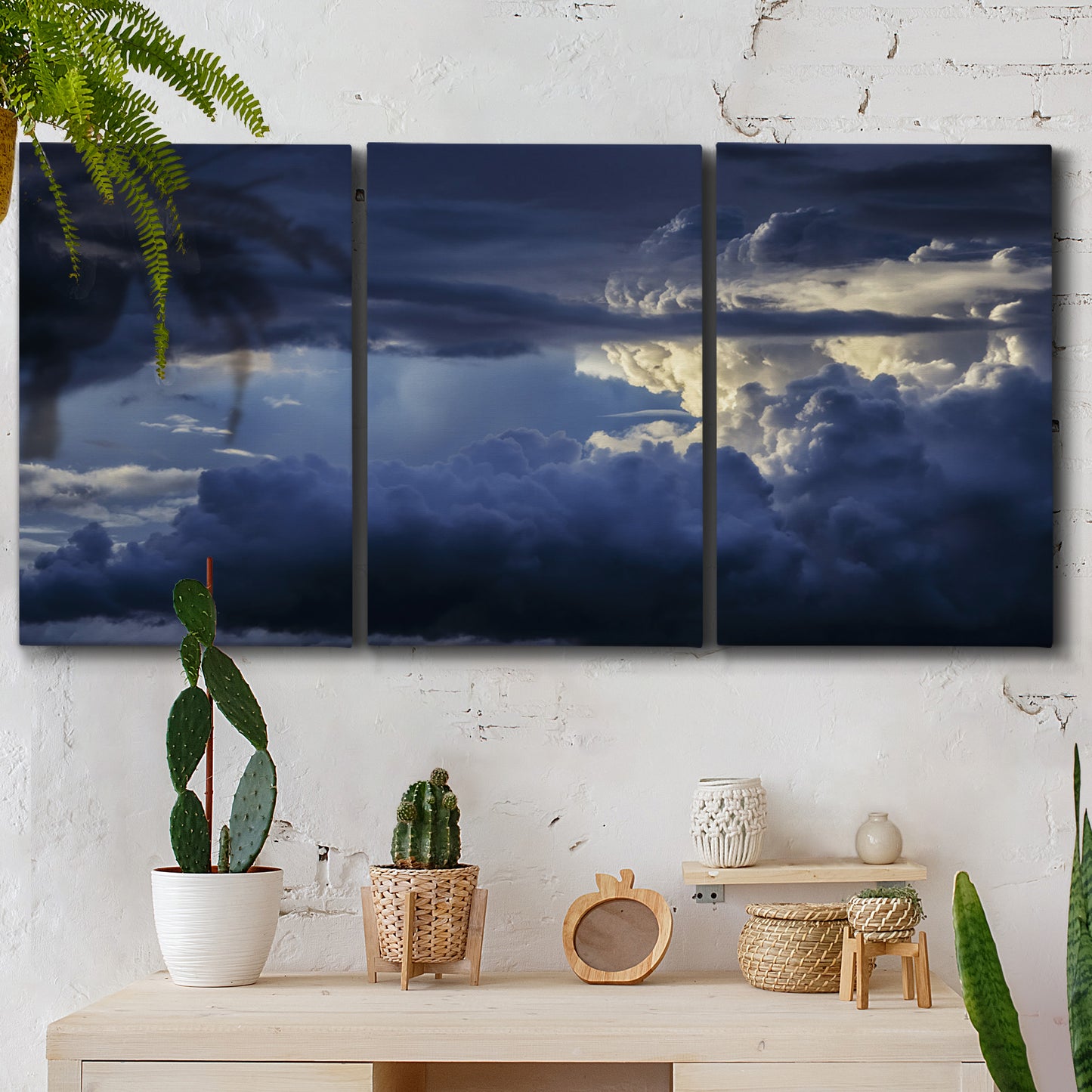 Three-panel canvas wall art featuring hot air balloons rising at dawn, displayed in a boho-chic entryway above a console table.