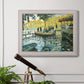 Impressionist riverside leisure scene by Claude Monet in an ornate weathered white frame displayed in a light-toned interior setting.