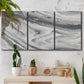 Three-panel canvas wall art featuring minimal monochrome abstract forms, displayed in a boho-chic entryway above a console table.
