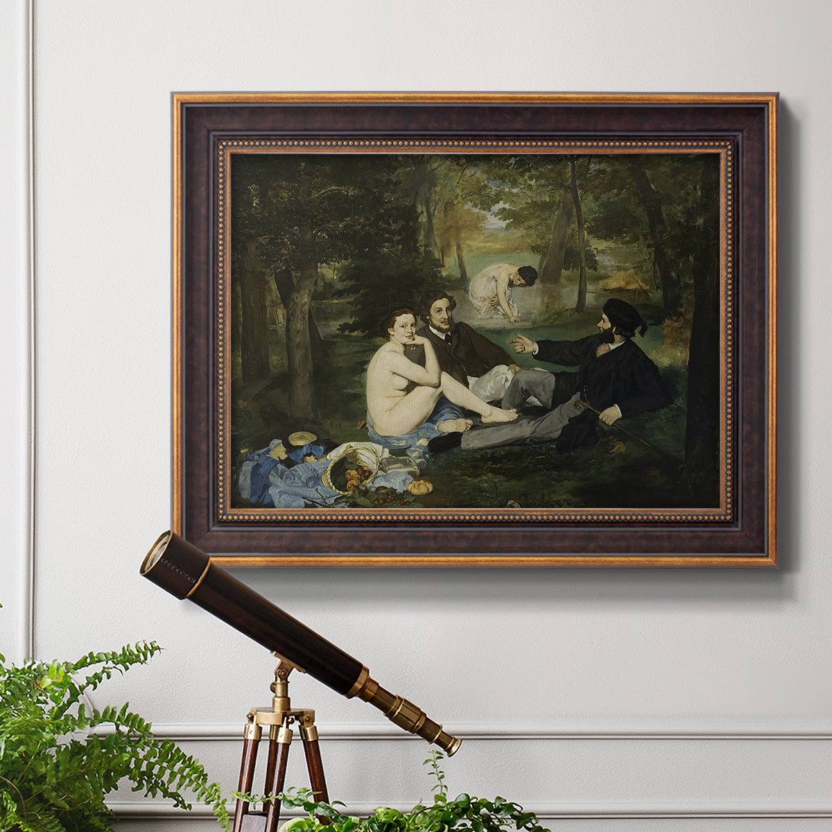 Groundbreaking impressionist picnic scene by Édouard Manet in an ornate bronzed mahogany wood frame displayed in a light-toned interior setting.
