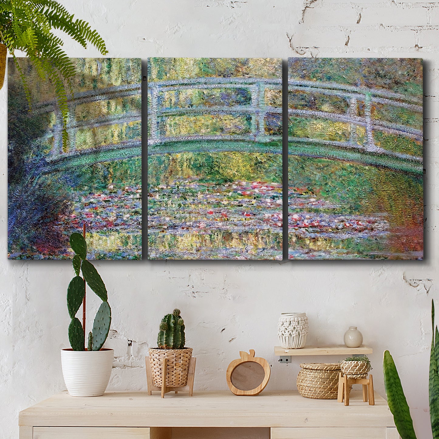 Three-panel canvas wall art featuring water lilies with arched bridge, displayed in a boho-chic entryway above a console table.