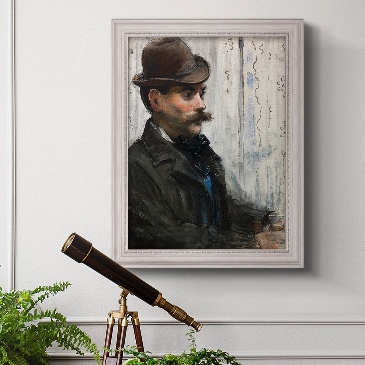 Impressionist portrait of a seated man by Édouard Manet in an ornate weathered white frame displayed in a light-toned interior setting.