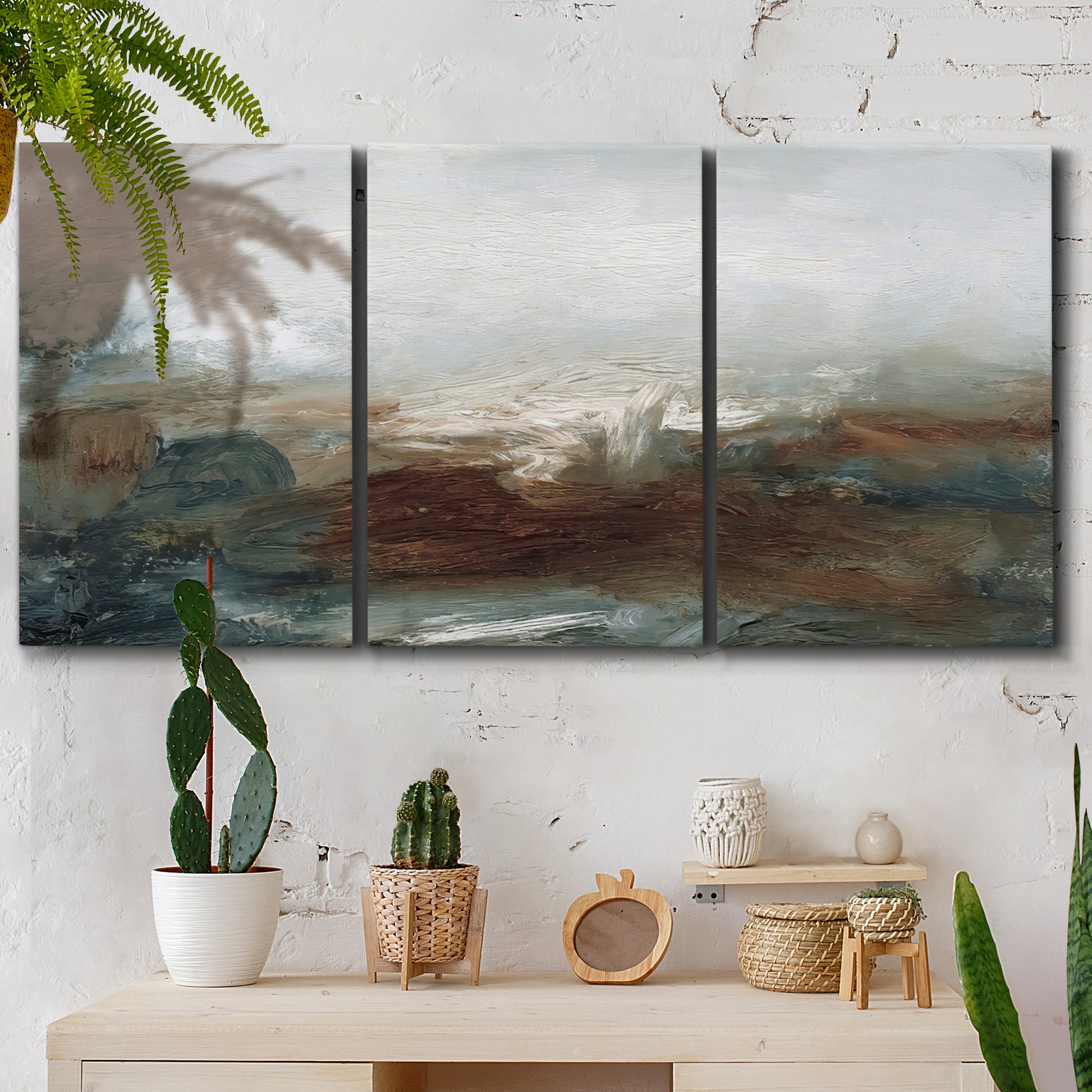 Three-panel canvas wall art featuring soft abstract evening light, displayed in a boho-chic entryway above a console table.