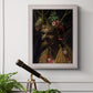 Surreal allegorical portrait representing the four seasons by Giuseppe Arcimboldo in an ornate weathered white frame displayed in a light-toned interior setting.