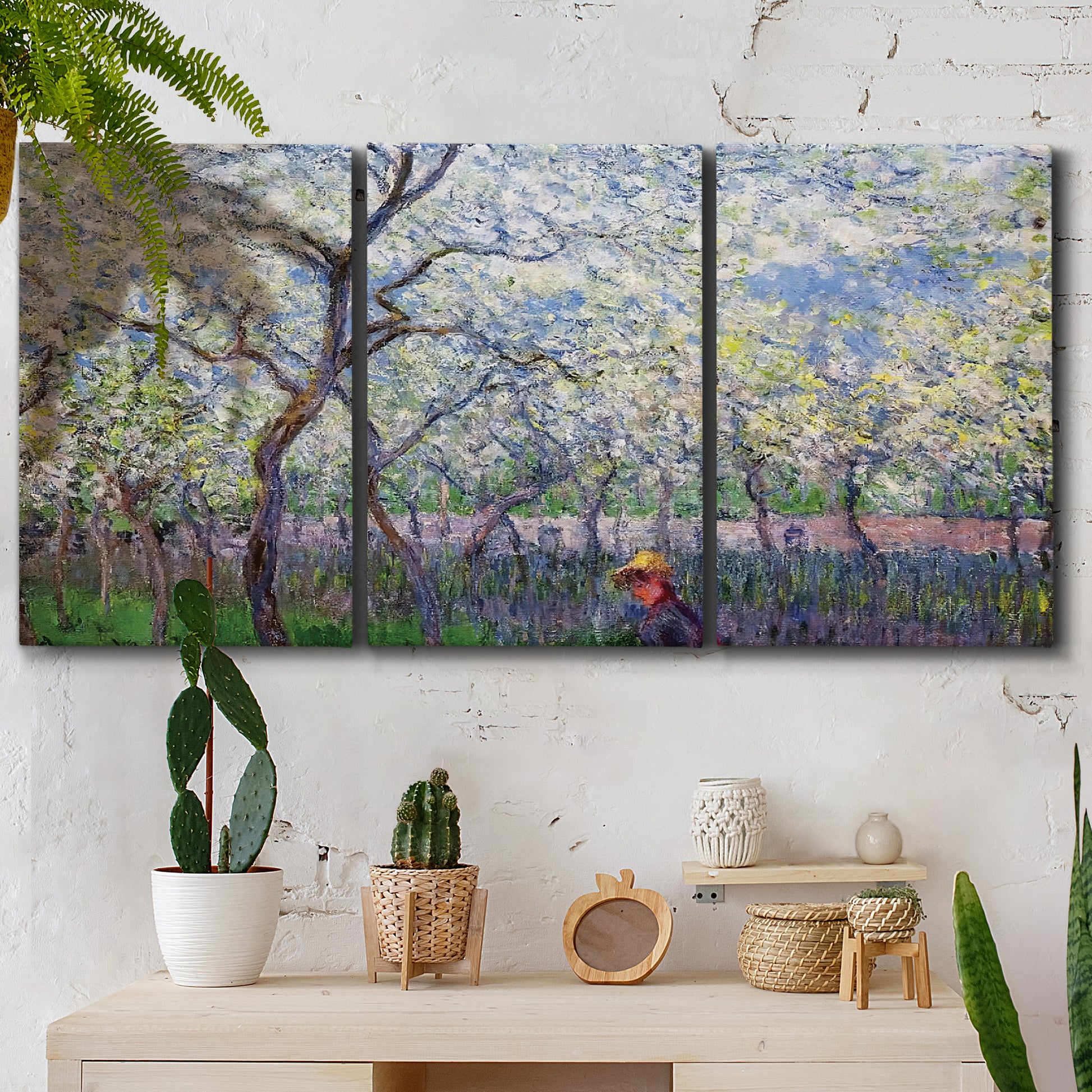 Three-panel canvas wall art featuring fresh spring countryside landscape, displayed in a boho-chic entryway above a console table.