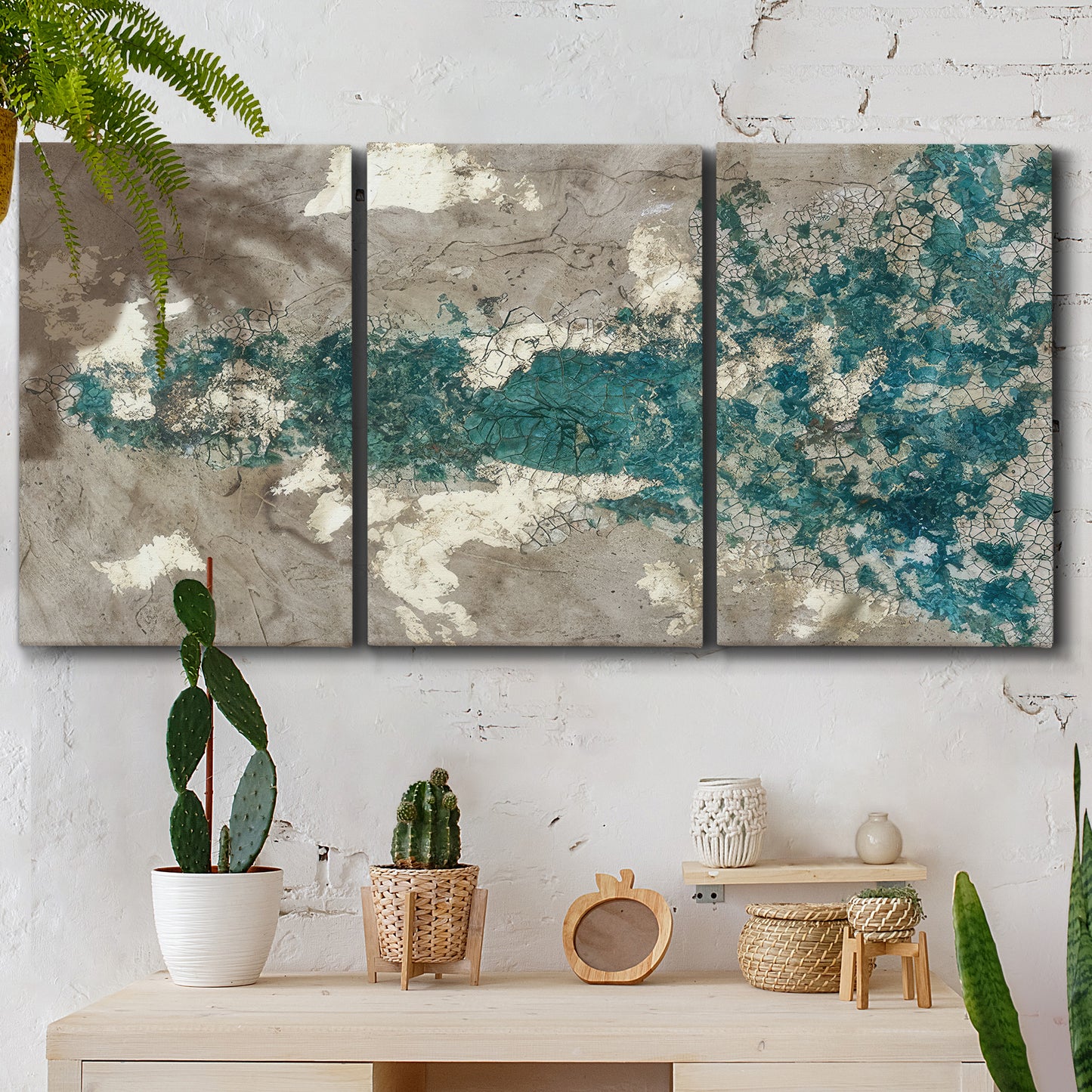 Three-panel canvas wall art featuring layered mineral abstract textures, displayed in a boho-chic entryway above a console table.