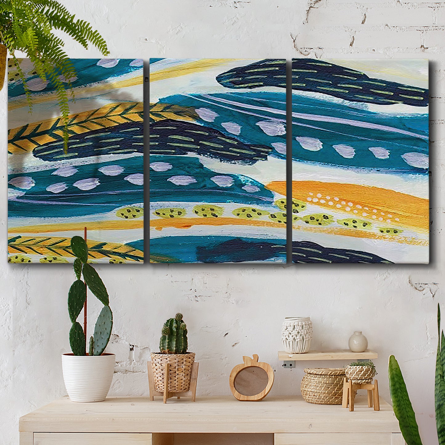 Three-panel canvas wall art featuring feather inspired abstract linear motion, displayed in a boho-chic entryway above a console table.