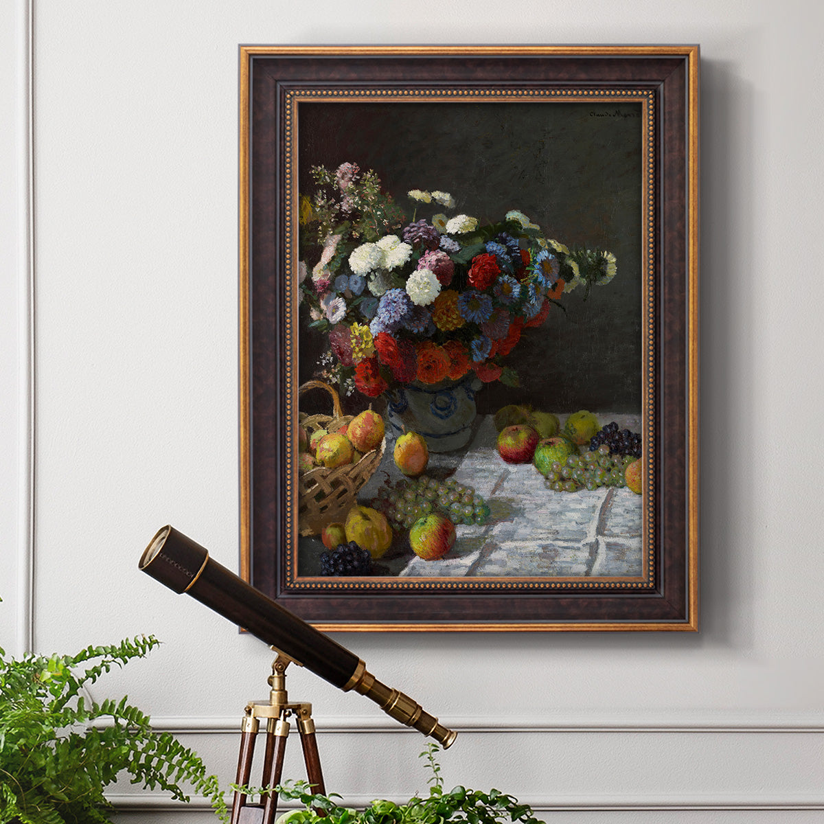 Impressionist floral still life painting by Claude Monet in an ornate bronzed mahogany wood frame displayed in a light-toned interior setting.