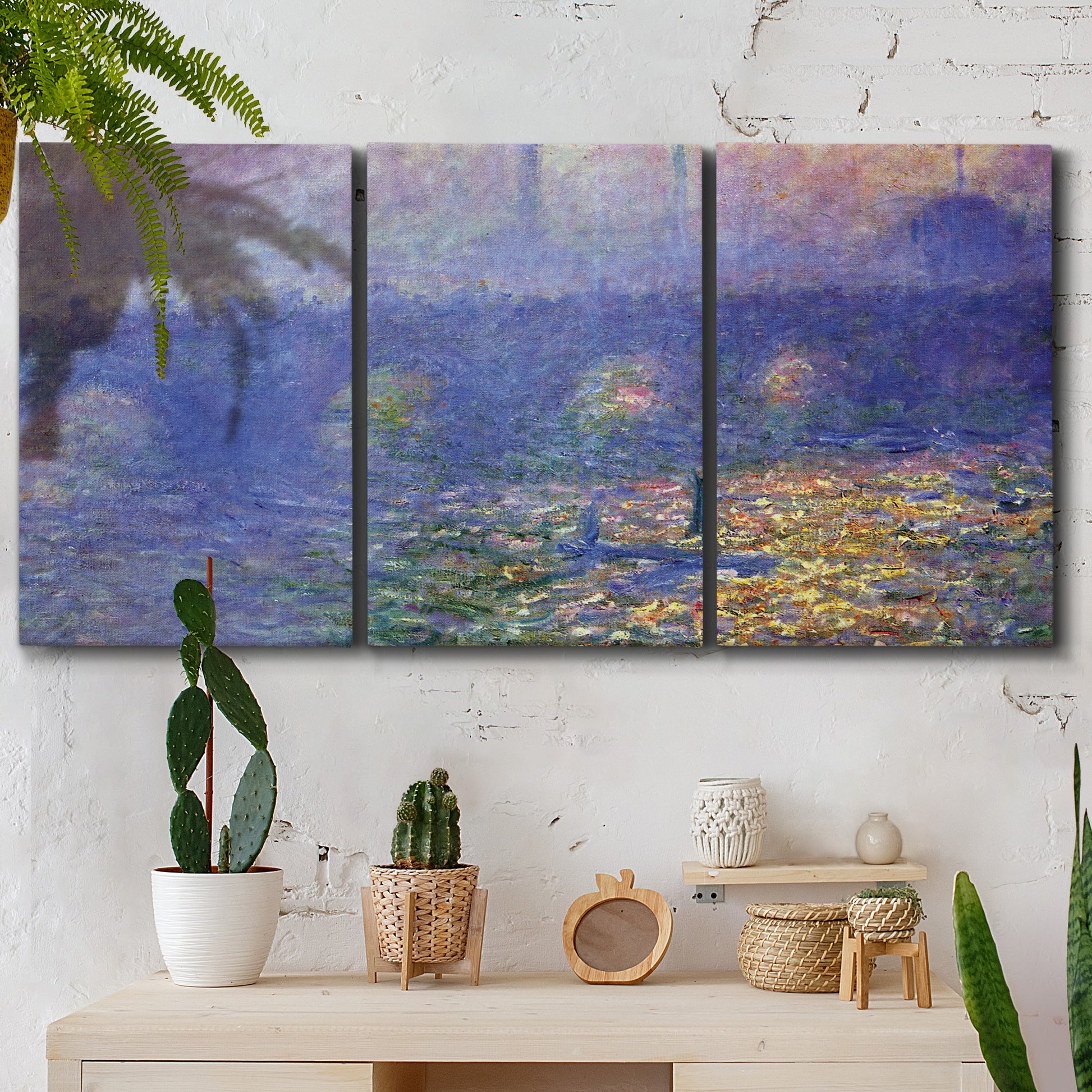 Three-panel canvas wall art featuring overcast bridge above river, displayed in a boho-chic entryway above a console table.