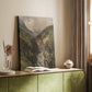 Canvas art print of a powerful waterfall rushing through a steep rocky valley styled in a home decor setting.