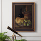 Realist still life with figs and bread by Luis Meléndez in an ornate bronzed mahogany wood frame displayed in a light-toned interior setting.