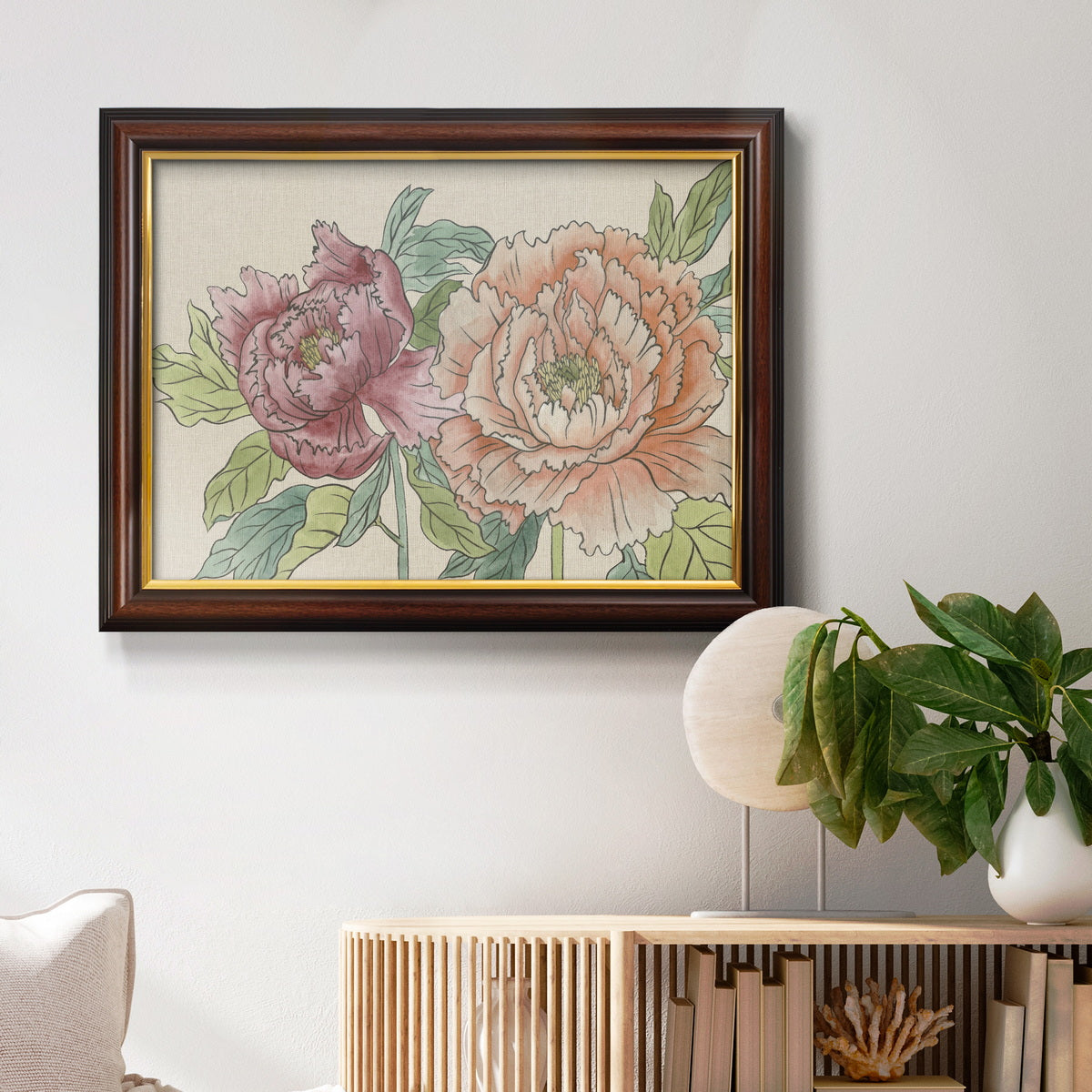 Modern peony floral drawing in an ornate mahogany wood frame with gold liner displayed in a light-toned interior setting.