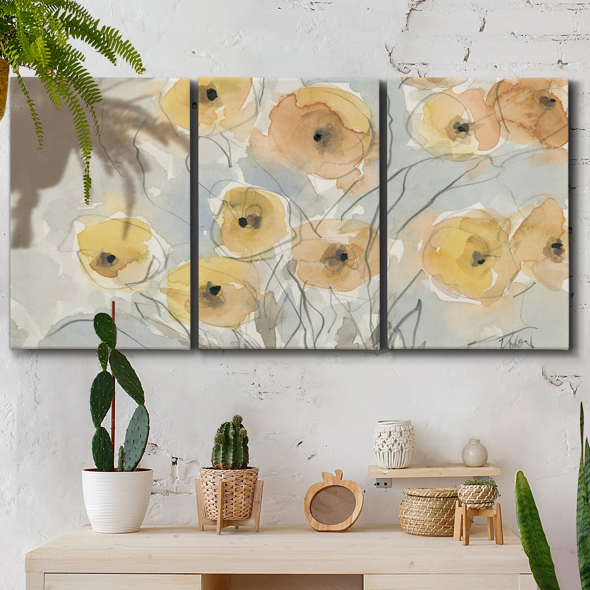 Three-panel canvas wall art featuring minimalist poppies at sunset, displayed in a boho-chic entryway above a console table.