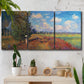 Three-panel canvas wall art featuring summer poppy field in bloom, displayed in a boho-chic entryway above a console table.