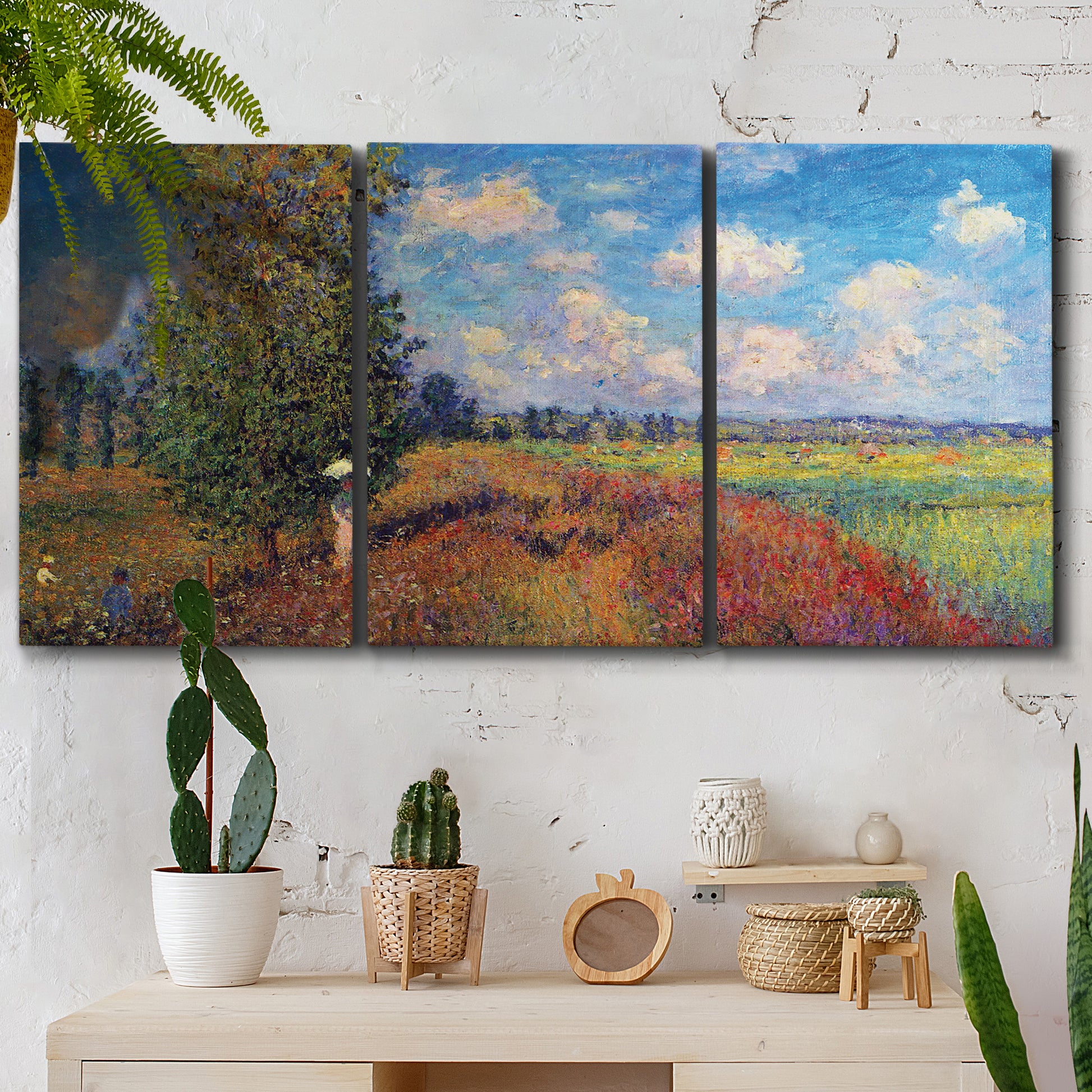 Three-panel canvas wall art featuring summer poppy field in bloom, displayed in a boho-chic entryway above a console table.