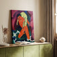 Canvas art print of a stylized figure with an animal in bold tones styled in a home decor setting.