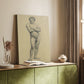 Canvas art print of a standing figure with defined posture and light shading styled in a home decor setting.