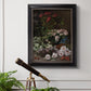 Early impressionist floral painting by Claude Monet in an ornate black frame with gilded inner detail displayed in a light-toned interior setting.