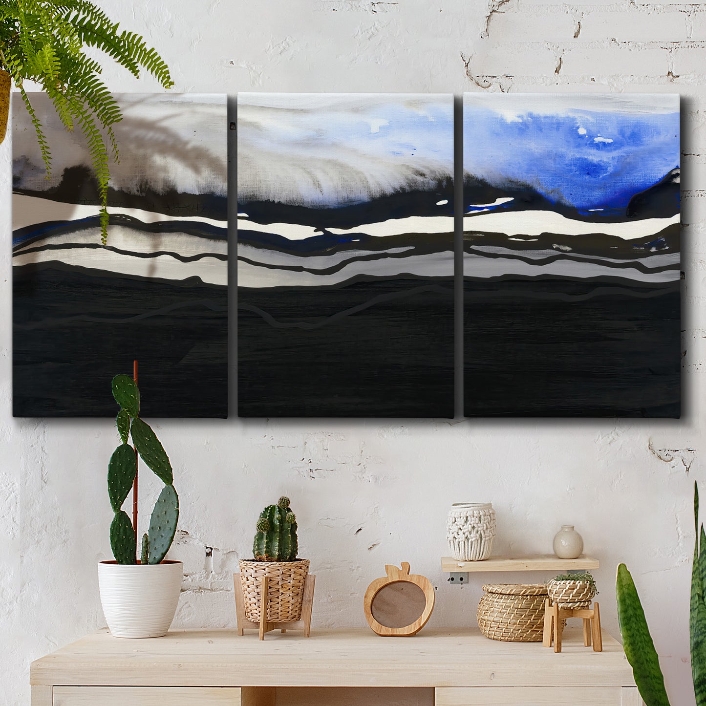 Three-panel canvas wall art featuring abstract passage of time composition, displayed in a boho-chic entryway above a console table.