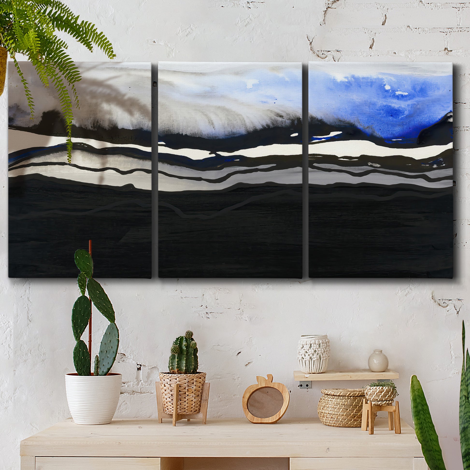 Three-panel canvas wall art featuring abstract passage of time composition, displayed in a boho-chic entryway above a console table.