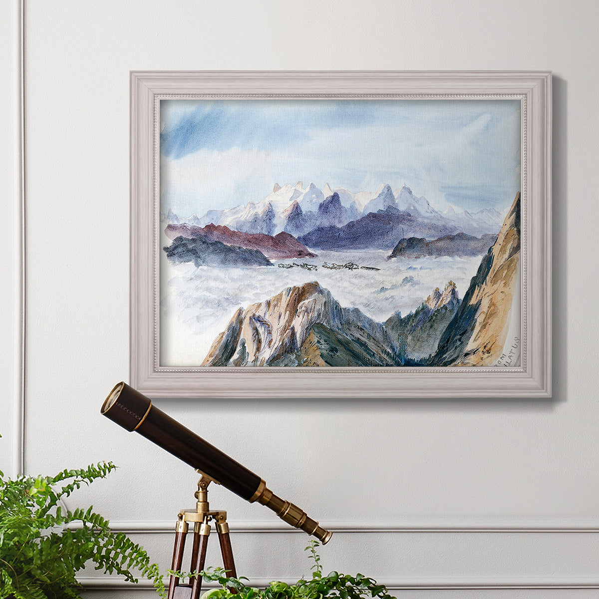 Impressionist alpine mountain landscape by John Singer Sargent in an ornate weathered white frame displayed in a light-toned interior setting.