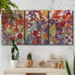 Three-panel canvas wall art featuring colorful floral arrangement, displayed in a boho-chic entryway above a console table.