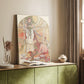 Canvas art print of a symbolic figure surrounded by decorative patterns and flowing lines styled in a home decor setting.