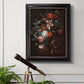 Classical floral still life painting by Jan van Huysum in an ornate black frame with gilded inner detail displayed in a light-toned interior setting.